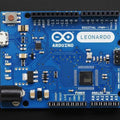 Arduino Leonardo R3 Board – ATMEGA32U4 Microcontroller, 20 I/o Pins, USB, 16MHz - a blue rectangular microcontroller circuit board featuring a USB port, power jack, reset button, and various pin headers.