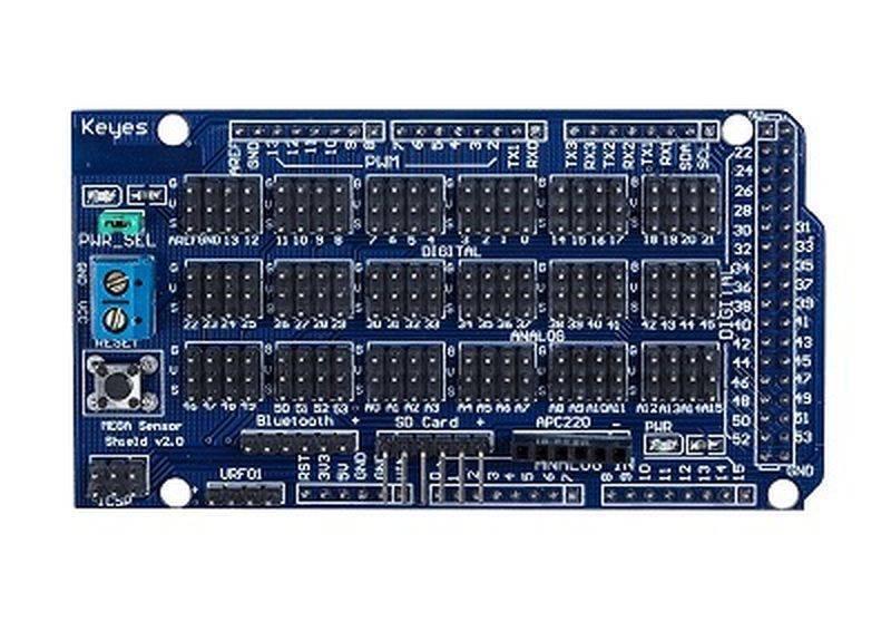 Arduino Mega Sensor Shield - a blue rectangular circuit board featuring numerous pin headers, a reset button, a terminal block, and various labeled ports.