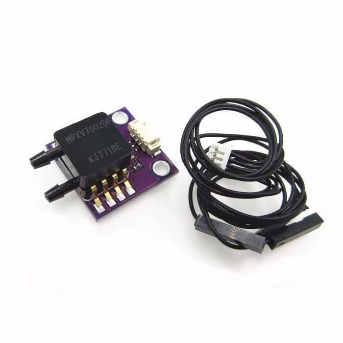 Arduino Pressure Sensor Module MPXV7002DP - shown with a purple breakout board, two black pressure ports, a white connector, and a black wiring harness.
