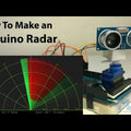 Arduino Radar Project - an HC-SR04 ultrasonic sensor mounted on a blue servo motor with a computer screen displaying a radar sweep interface.