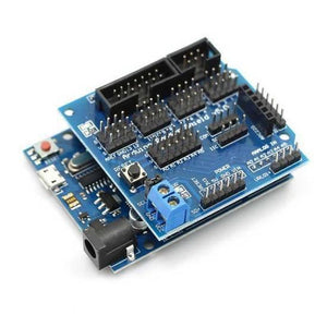 Arduino Sensor Shield V5 Expansion Board For Arduino - a blue circuit board with multiple pin headers, a reset button, and a blue screw terminal, mounted on an Arduino.
