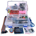 Arduino Starter Kit Arduino Basic Kit Arduino Beginner Kit - an open clear compartment box with a breadboard, sensor shield, stepper motor, IR remote, jumper wires, LEDs and resistors.