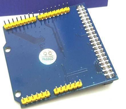 Arduino Uno LCD TFT Shield For 40-pin 8bit TFT LCD - the blue underside of the PCB with yellow pin headers and a white QC Passed sticker.