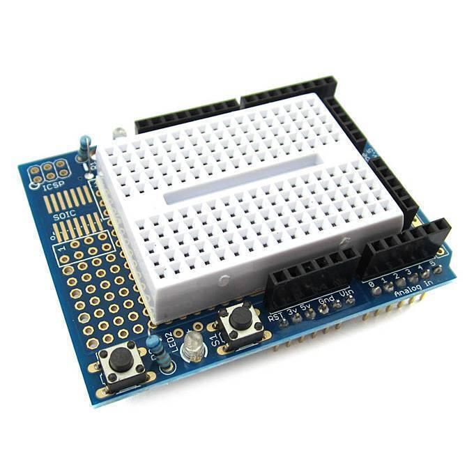 Arduino Uno Proto Shield With Syb-170 Mini Breadboard - a blue circuit board with a white mini breadboard, two push buttons, and an LED.