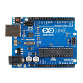 Arduino Uno R3 - board from above, showing its USB-B port, barrel power jack, ATmega328P-PU DIP chip and the digital and analog pin headers.