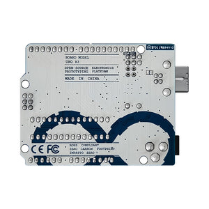 Arduino Uno R3 - the white and blue bottom side of the circuit board with a USB connector and various pin headers.