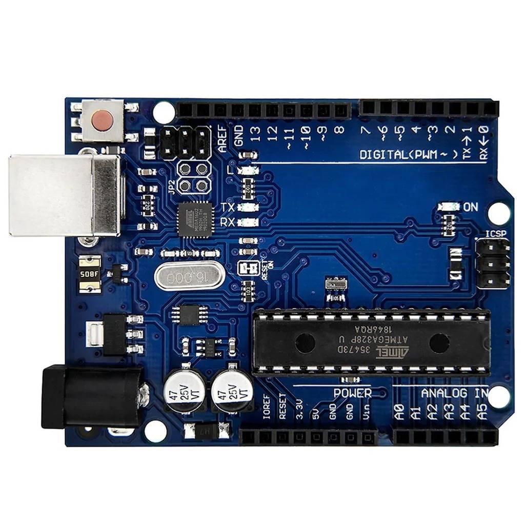 Arduino Uno R3 DIP With USB Cable Without Arduino Logo - a blue rectangular microcontroller board featuring a large central chip, a USB port, a power jack, and various pin headers.