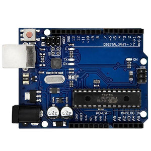 Arduino Uno R3 DIP With USB Cable Without Arduino Logo - a blue rectangular microcontroller board featuring a large central chip, a USB port, a power jack, and various pin headers.