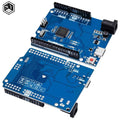 Arduino Uno R4 Minima Clone - two blue circuit boards with headers, a USB-C port, a power jack, and a red reset button.