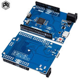Arduino Uno R4 Minima Clone - two blue circuit boards with headers, a USB-C port, a power jack, and a red reset button.