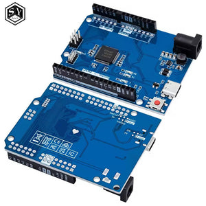 Arduino Uno R4 Minima Clone - two blue circuit boards with headers, a USB-C port, a power jack, and a red reset button.