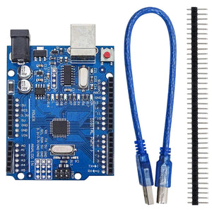 Arduino Uno With USB Cable SMD - a blue microcontroller board with a USB port and power jack, a blue USB cable, and a strip of header pins.