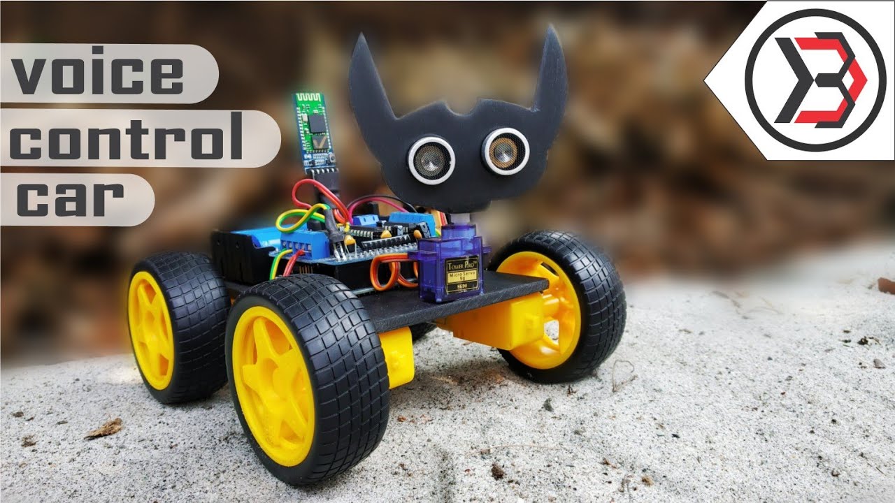 Arduino Voice Controlled kit - assembled as a four-wheeled robot with yellow wheels, a black bat-shaped ultrasonic sensor head, and a Bluetooth module.