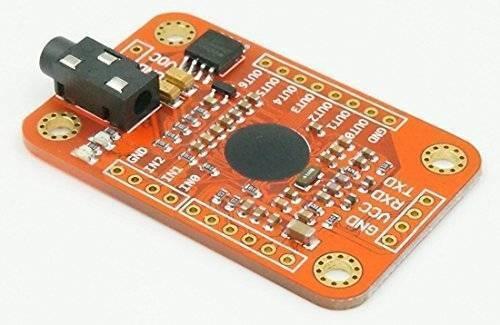Arduino Voice Recognition Module V3 - an orange rectangular circuit board featuring a black 3.5mm audio jack, a circular sensor, and multiple pin headers.