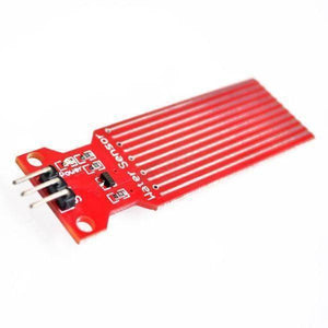 Arduino Water Level Sensor - a red rectangular circuit board with exposed conductive traces and a three-pin header connector.
