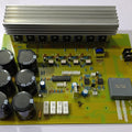 Assembled Local 8 IGBT Inverter PCB Board - a yellow circuit board featuring a large aluminum heatsink, six capacitors, and a terminal block for connections.