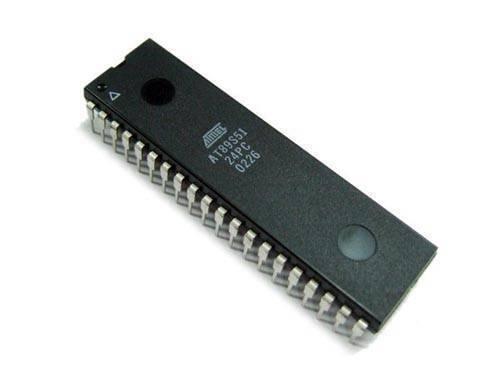 AT89S51 CMOS 8 Bit Microcontroller - a black rectangular integrated circuit with two rows of metal pins and white text printed on the top surface.
