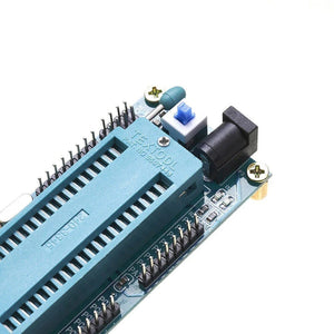 ATMEGA16 ATMEGA32 Isp Avr Minimum Development System Board Module - a close-up of the blue ZIF socket, power jack, and push button.