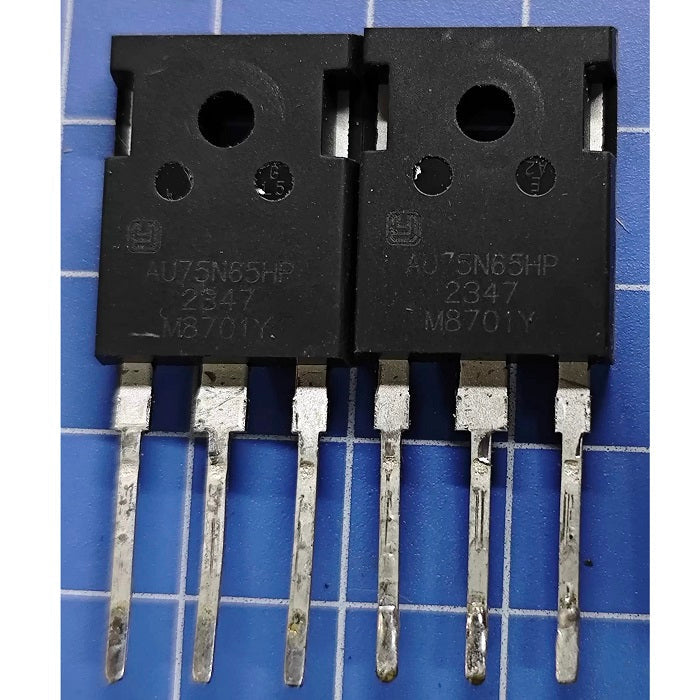 AU75N65HP IGBT - High-performance Transistor For Power Applications - two black, three-pin electronic transistors with white printed text, arranged side-by-side on a blue grid cutting mat.