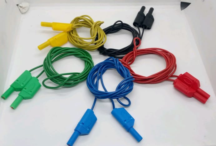 Banana Clip Wires 4mm | High-Quality Test Leads | Digilog.pk - five sets of test leads with 4mm banana plugs in yellow, black, green, blue, and red colours arranged on a white surface.