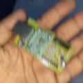 Base Kit For Specific Customers Not For Everyone - a small green rectangular circuit board held in a person's palm.