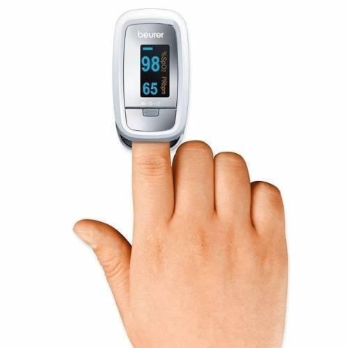 Beurer Finger Pulse Oximeter Oxygen Monitor Po-30 - a white and silver device with a digital display reading 98 for SpO2 and 65 for PRbpm.