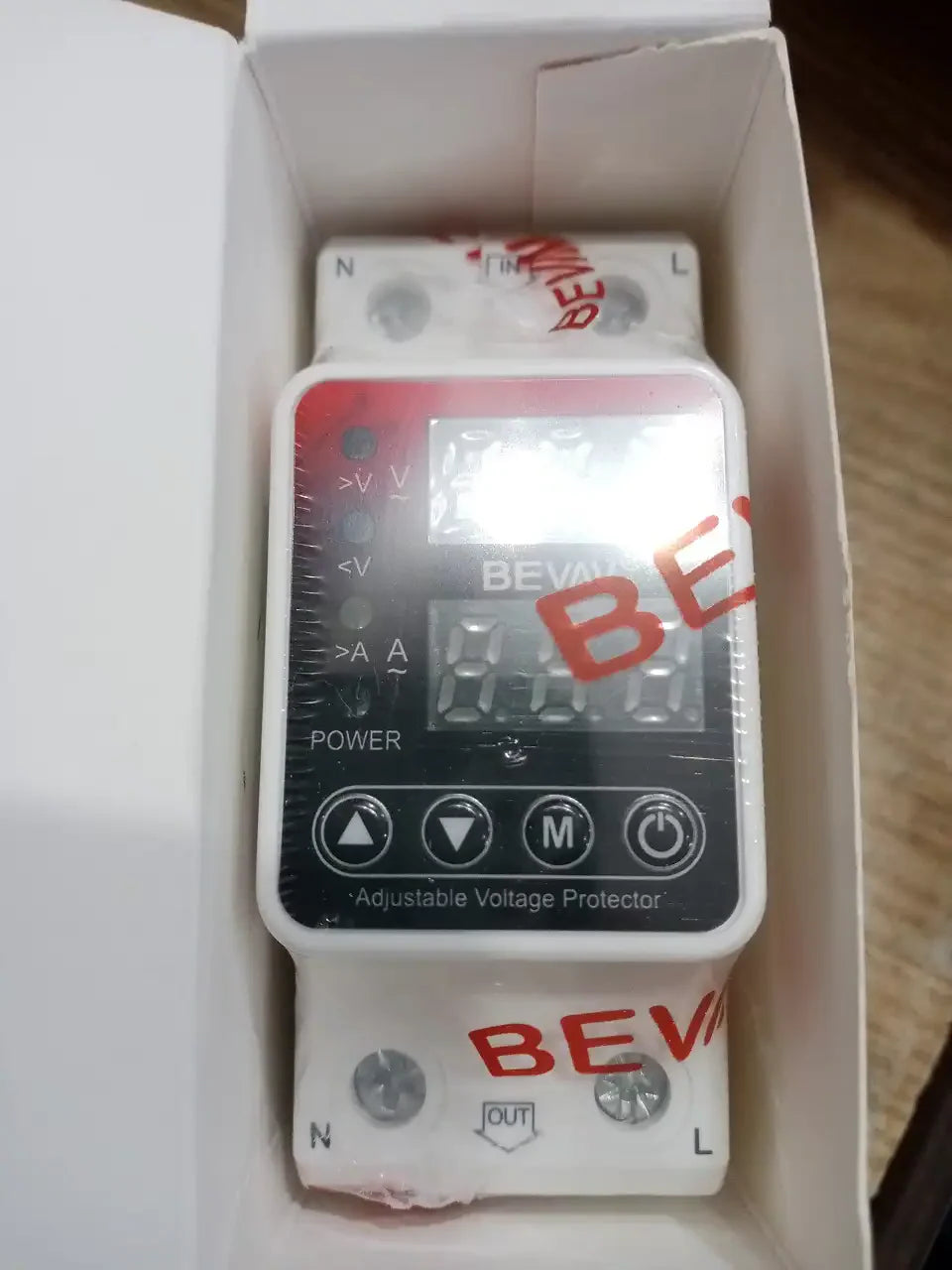 Bevav 63amp Adjustable Under Over Voltage Protector Relay - in its white box, showing a digital display, four control buttons, and input/output terminals for N and L wires.