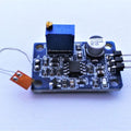 BF350 Strain Gauge Sensor Module - a blue circuit board with a potentiometer, a capacitor, a three-pin connector, and an attached strain gauge.