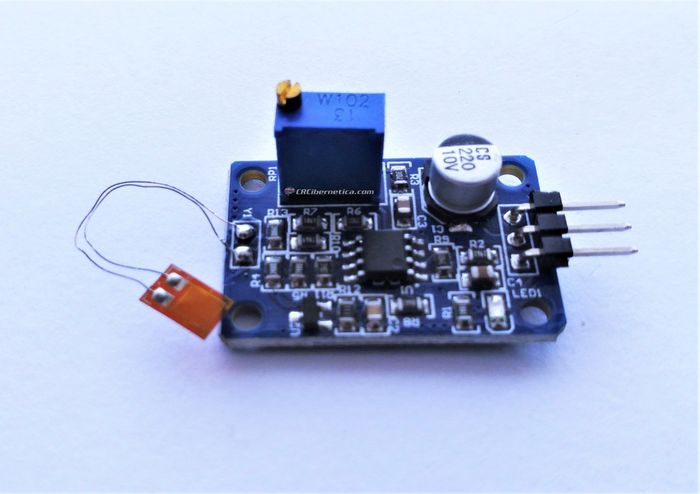 BF350 Strain Gauge Sensor Module - a blue circuit board with a potentiometer, a capacitor, a three-pin connector, and an attached strain gauge.