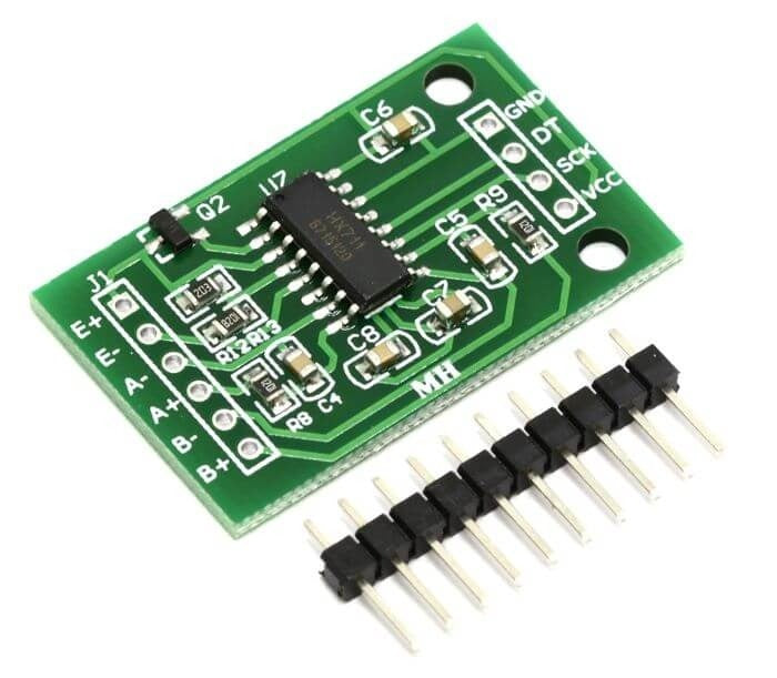 Big PCB HX711 Weighing Sensor Load Cell Amplifier Module Analog To Digital Converter Pressure Sensor - a green rectangular PCB with an integrated circuit, labeled pin headers, and a separate row of ten metal connector pins.