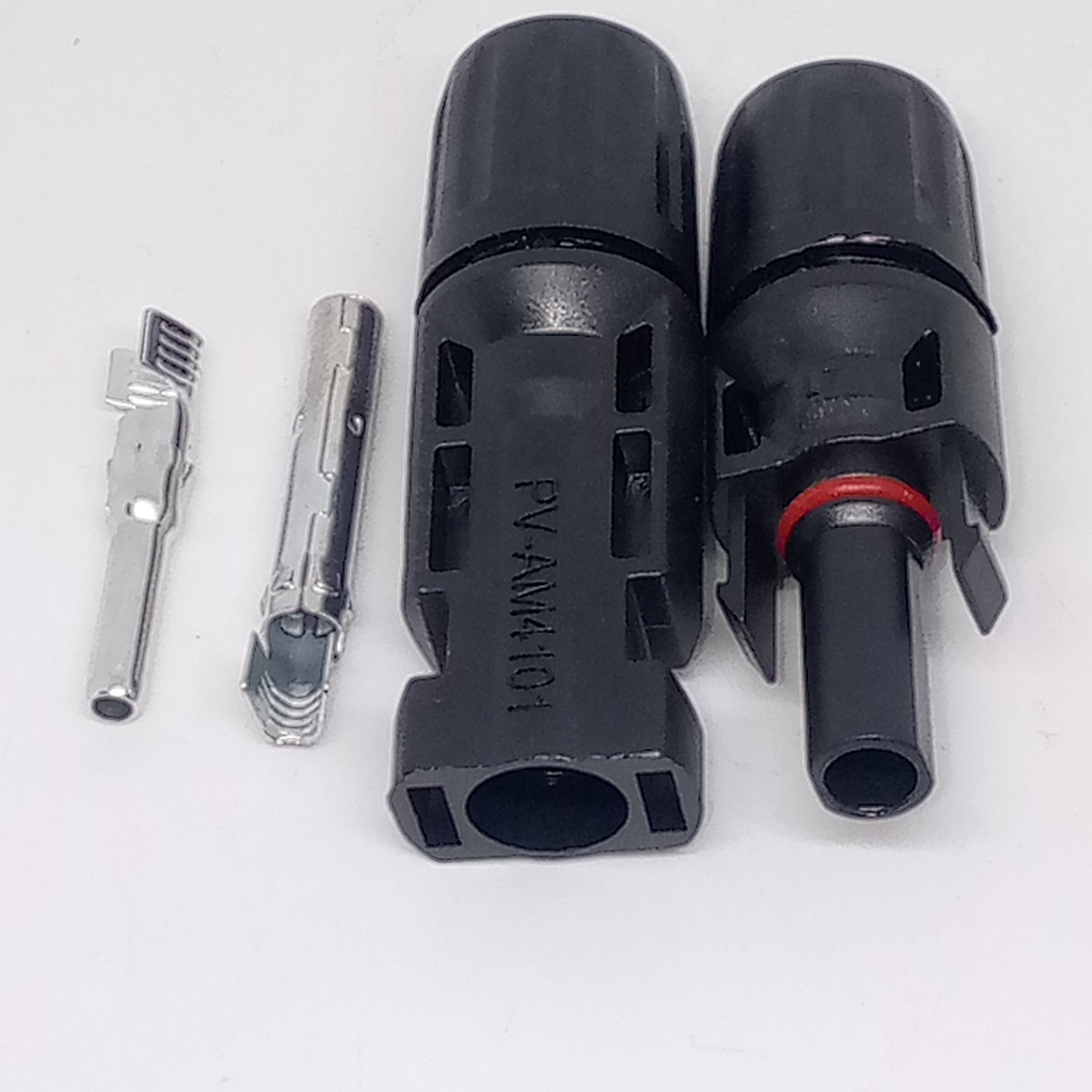 Big Size 50MMX17MM 30A 1500V Male Female MC4 Connector For Solar Panel DC Wire Cable - two black plastic connector housings, one marked PV-AM4101, and two metal crimp terminals arranged on a white surface.