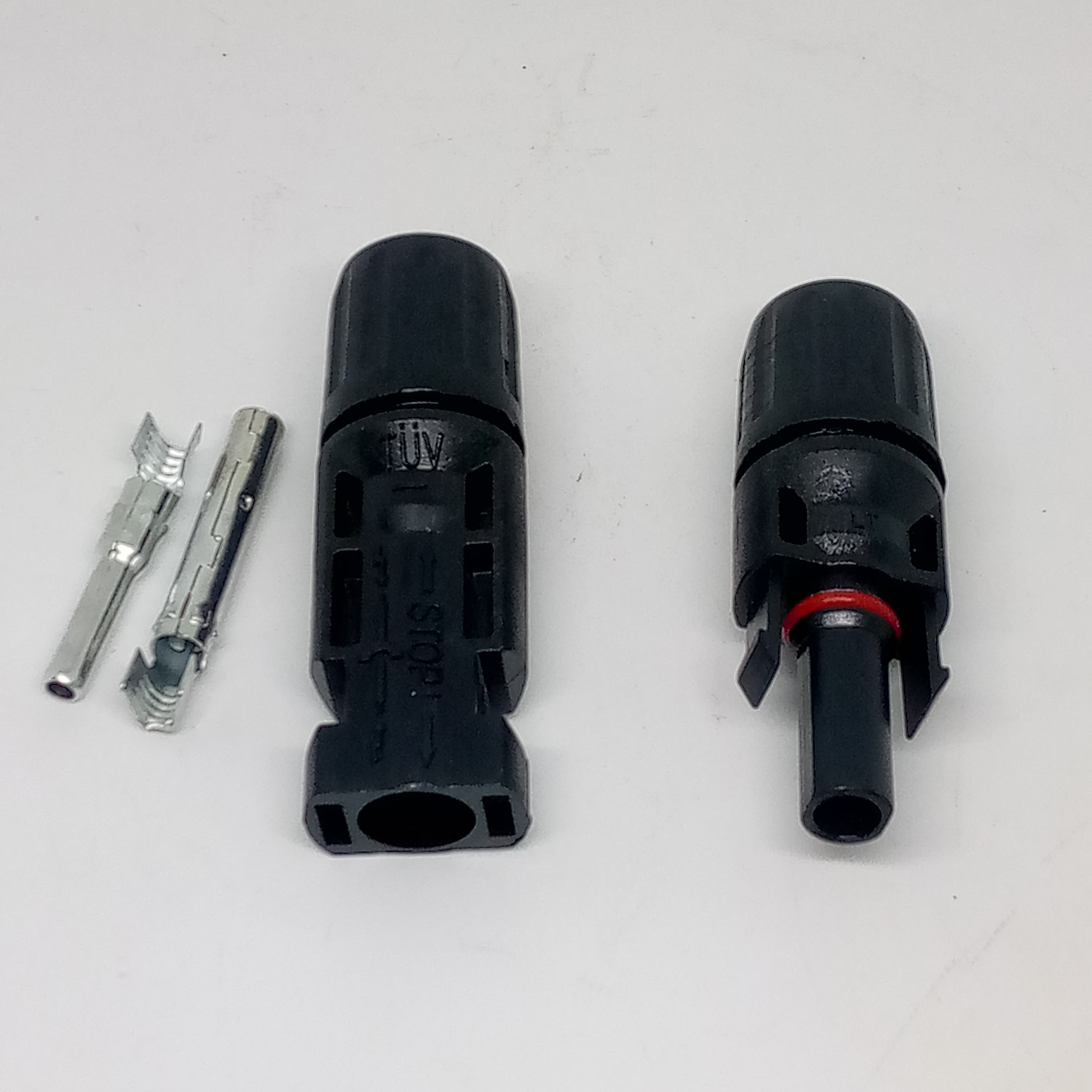 Big Size 50MMX17MM 30A 1500V Male Female MC4 Connector For Solar Panel DC Wire Cable - two black plastic connector housings, one with a red O-ring, and two silver metal crimp pins.