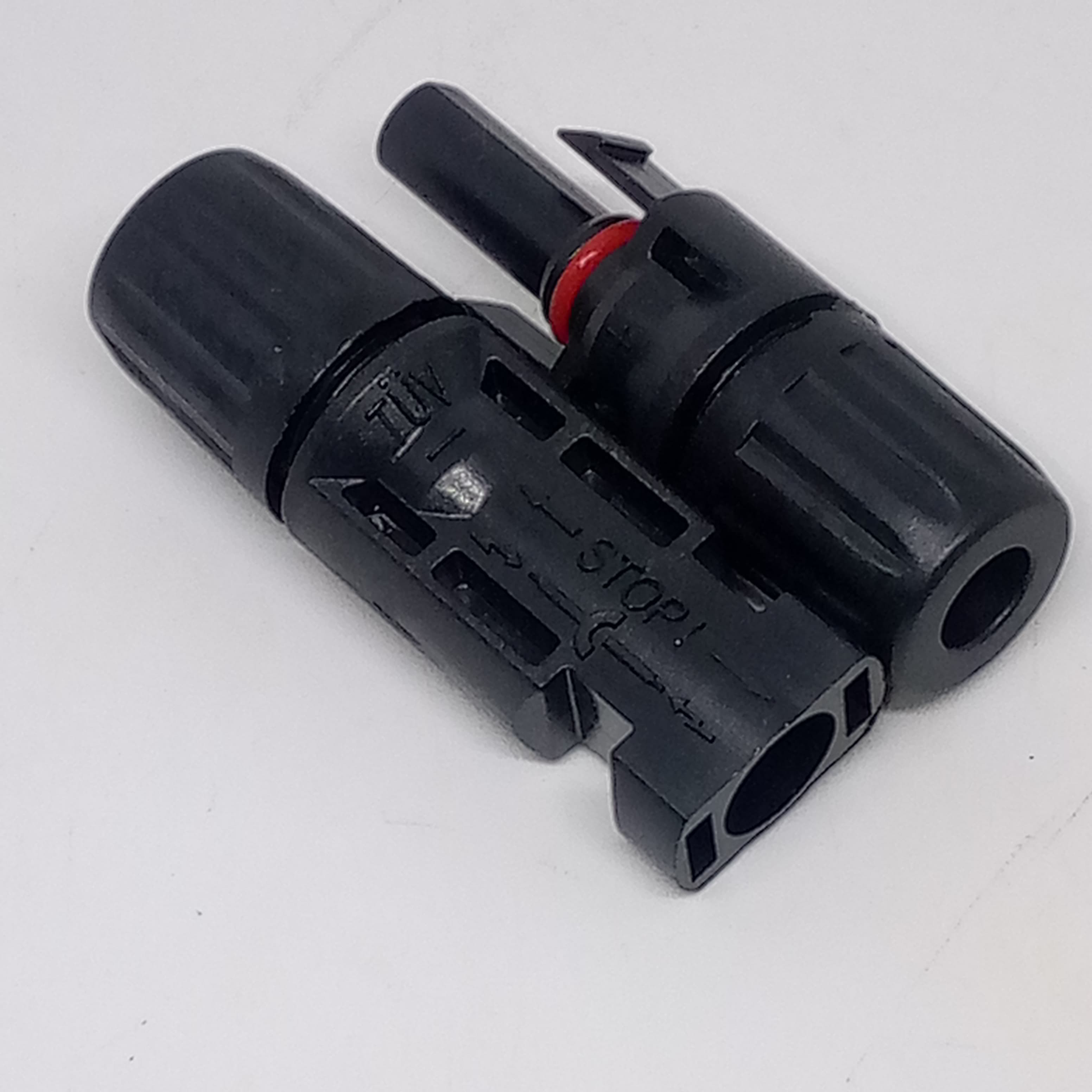 Big Size 50MMX17MM 30A 1500V Male Female MC4 Connector For Solar Panel DC Wire Cable - a pair of black male and female plastic electrical connectors with TUV and STOP markings on the housing.