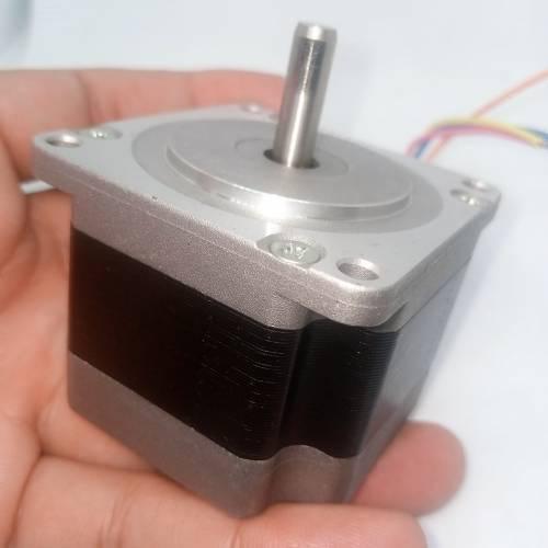 Bipolar NEMA23 1A Stepper Motor 4 Wire Stepper Motor - a silver and black square-bodied motor with a central metal shaft and multi-colored wires held in a hand.