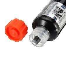 Black Mechanic UV Curable 10CC Solder Mask Ink PCB Fixing Repairing Welding Oil Paint Prevent Corrosive Arcing - a close-up showing the black ink syringe with its nozzle exposed and the detached orange plastic cap.