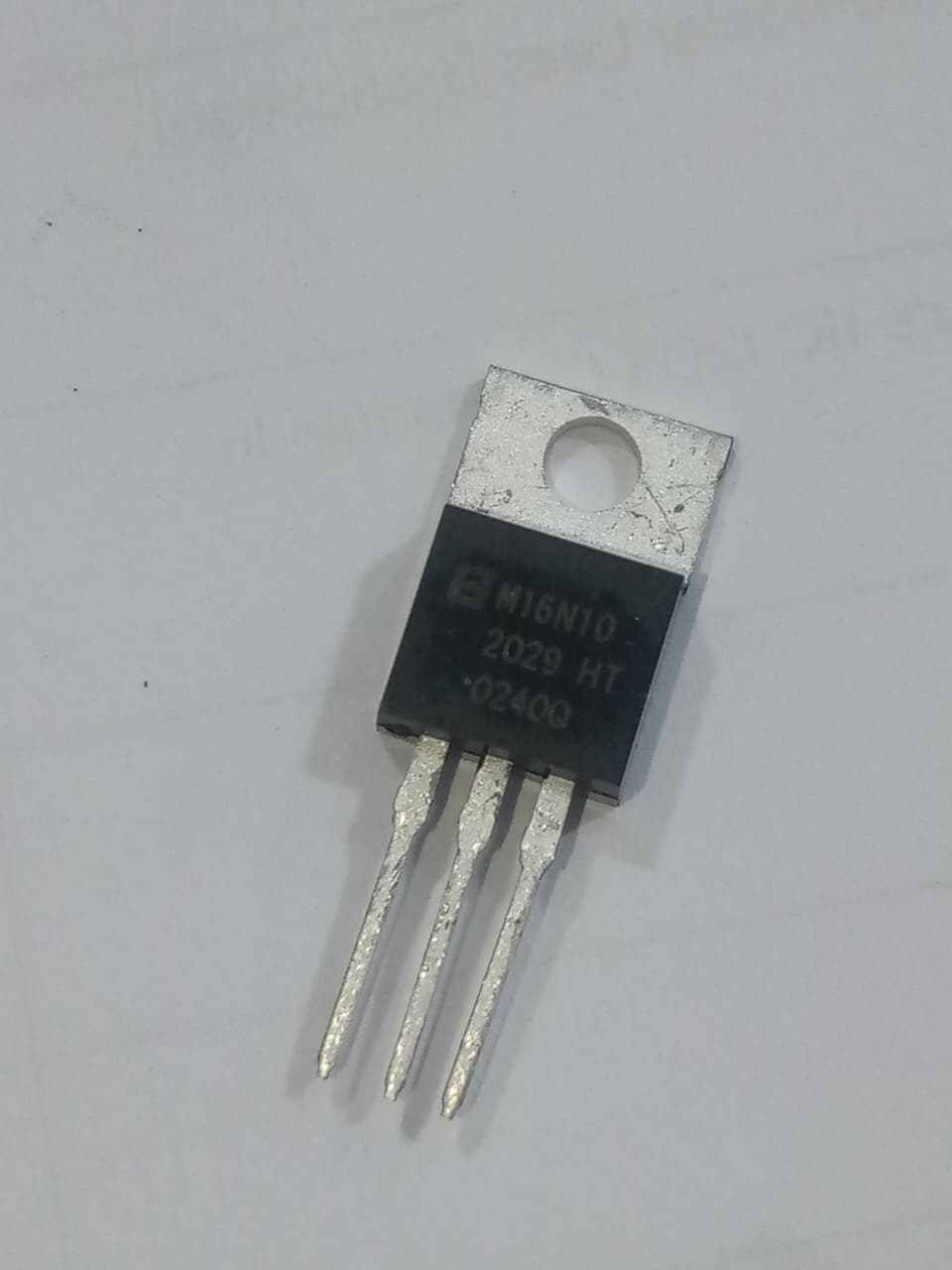BLM16N10 MOSFET - a black, three-pin electronic component with a metal mounting tab, shown in a close-up view against a white background.