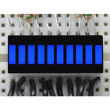 Blue 10 Segment Light Bar Graph LED Display - ten illuminated blue rectangular segments mounted on a white breadboard with connected wires.