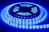 Blue Color 12V DC Strip Light Rolls 5 Meter Each - shown as a coiled, illuminated blue LED strip on a black plastic spool.