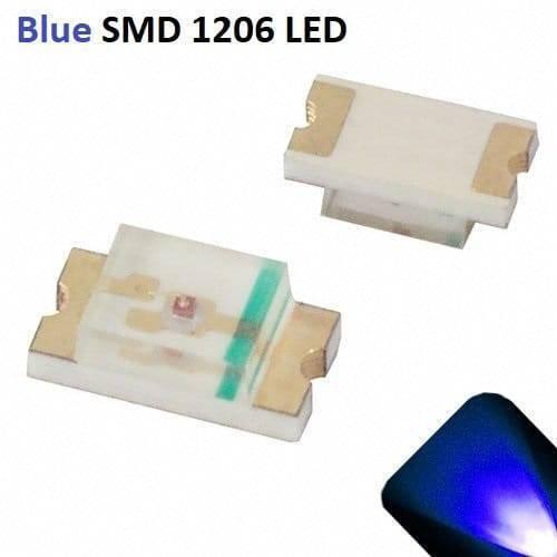 Blue SMD 1206 LED Super Bright Light Emitting Diode - two white surface-mount light-emitting diodes with gold-plated contacts and a small blue glowing light effect in the corner.