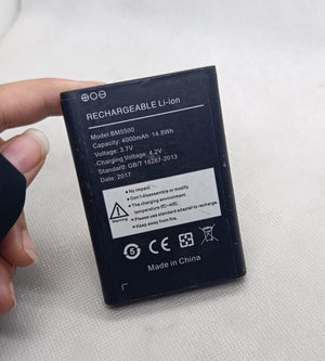 BM5500 3.7V 4000mA Battery - a rectangular black lithium-ion cell held in a hand with technical specifications and safety warnings printed on the front.