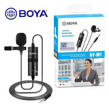 Boya BY-M1 Omnidirectional Lavalier Microphone (black) - shown as a black wired lapel mic with a power module and its retail packaging box featuring a woman using the device.