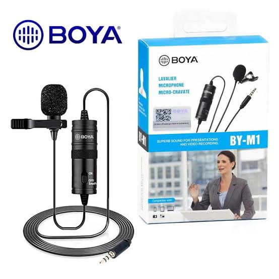 Boya BY-M1 Omnidirectional Lavalier Microphone (black) - shown as a black wired lapel mic with a power module and its retail packaging box featuring a woman using the device.