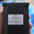 Brand New High Quality 57BYGH76 NEMA 23 Bipolar Stepper Motor 76mm 4.0A 1.8nm - a black square-bodied motor with a metal shaft and a white label showing specifications in Chinese and English.