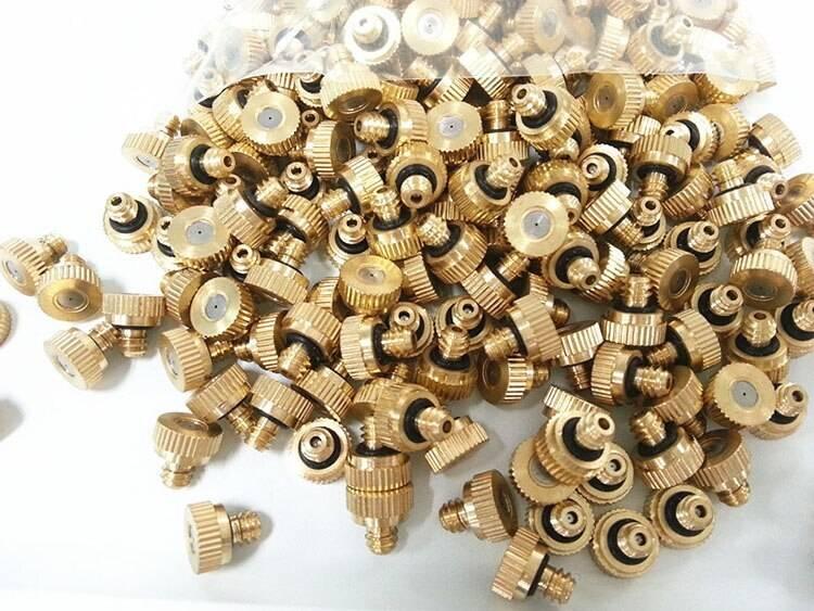 Brass Misting Nozzle 0.5mm Water Sprayer Fogging Nozzle - a large pile of gold-coloured brass nozzles with threaded connectors and black O-rings.