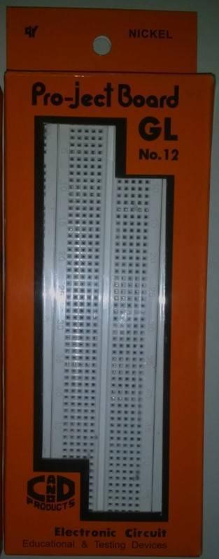 Breadboard Project Board Gl No 12 - shown in its original orange retail packaging with the white breadboard visible through a rectangular cutout.