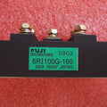 Bridge Rectifier Module 6RI100G-160 100A-1600V Fuji - a black rectangular electronic component with three metal screw terminals and a green label.
