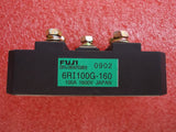 Bridge Rectifier Module 6RI100G-160 100A-1600V Fuji - a black rectangular electronic component with three metal screw terminals and a green label.