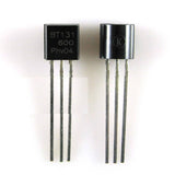 BTA131 - shown as two black, three-legged electronic components with "BT131 600 Phv04" and a "K" symbol printed on their flat faces.