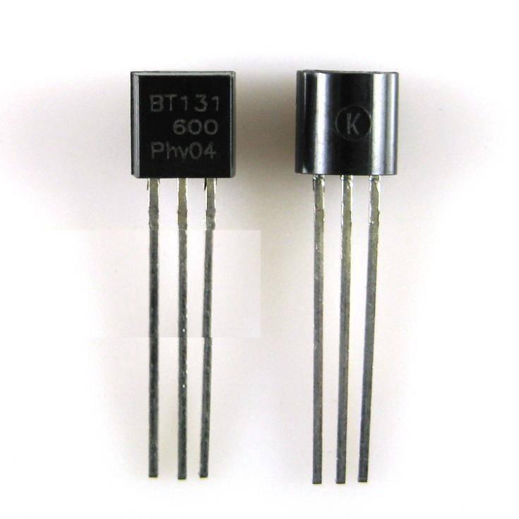 BTA131 - shown as two black, three-legged electronic components with "BT131 600 Phv04" and a "K" symbol printed on their flat faces.
