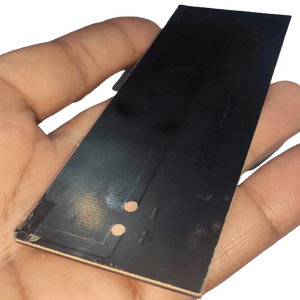 Buy 6V Mini Solar Cell Solar Module | Monocrystalline Solar Panel For DIY Projects At Digilog.pk - a rectangular black solar panel held in a hand, featuring visible positive and negative terminal markings.